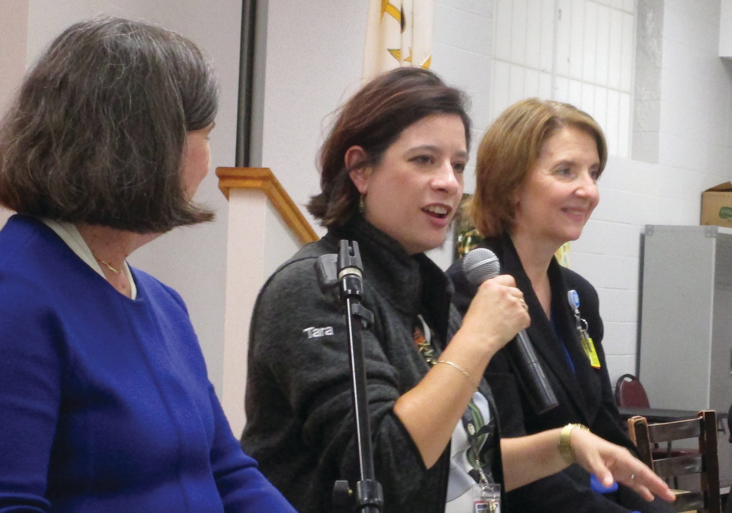 MESSAGE OF HOPE: Tara Tang, outreach coordinator for Butler Hospital’s Memory & Aging Program, speaks during last week’s panel discussion at the Cranston Enrichment Center. Looking on are Catherine Taylor, left, and Terry Fogerty, right.